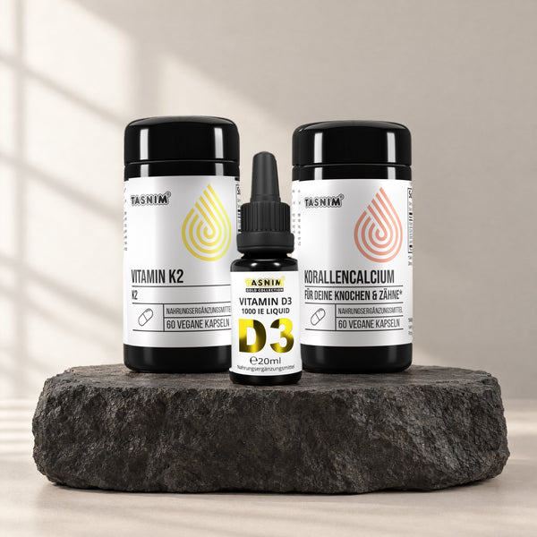 Knochen Basis Trio: Vitamin D3 Tropfen, Vitamin K2 und Korallencalcium auf Basaltstein