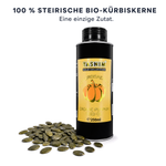 Flasche Tasnim Bio Kürbiskernöl 250 ml neben geschälten steirischen Bio-Kürbiskernen – eine einzige Zutat