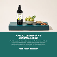 Amla, die indische Stachelbeere: Pumpflasche neben frischen Amla-Früchten, Sesamsamen und Mandeln – Amlaöl mit Sesamöl, Bittermandelöl und Vitamin E