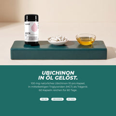 Ubichinon in Öl gelöst: Dose mit weißen Kapseln und einer Schale Öl – 100 mg natürliches Ubichinon-10 in MCT-Öl pro Kapsel
