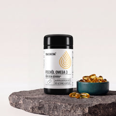 Tasnim Fischöl Omega 3, Dose mit 60 Kapseln auf Basaltplatte mit Petrol-Schale voller Omega-3-Kapseln