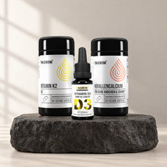 Knochen Basis Trio: Vitamin D3 Tropfen, Vitamin K2 und Korallencalcium auf Basaltstein