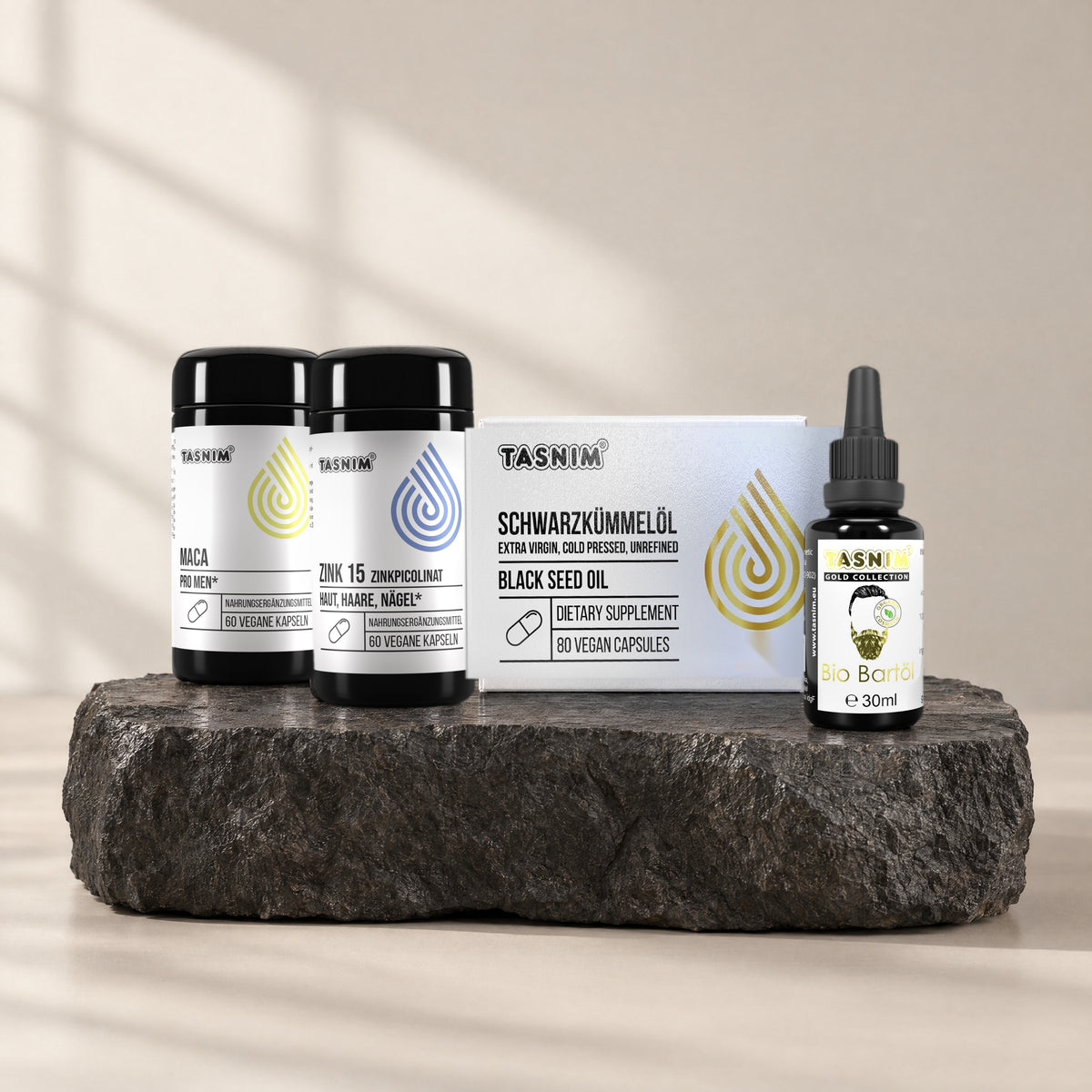 Men's Daily Set: Maca, Zink 15, Schwarzkümmelöl-Kapseln und Bio-Bartöl auf Basaltstein